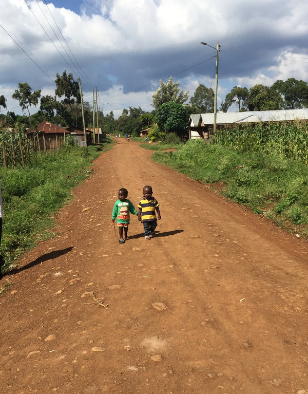 Two young boys on a street in Kisumu